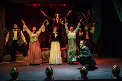 (front right) Kevin Webb with (back, l to r) Matt McNabb, Maiko Terazawa, Megan DeLay, Ryan Lanning, Jessica Lauren Fisher and Jeremy Trager in Black Button Eyes Productions’ Chicago premiere musical NEVERMORE – The Imaginary Life and Mysterious Death of Edgar Allan Poe.
