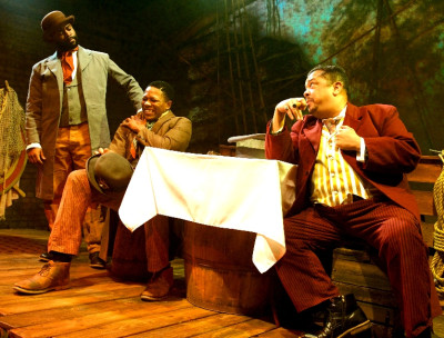 (L to R) Benjamin Jenkins as Santos, Ajax Dontavius as Rutherford Calhoun, and Linsey Falls as Papa Zerinque; in Lifeline Theatre’s “Middle Passage”, adapted by Ilesa Duncan &amp; David Barr III, directed by Ilesa Duncan, based on the novel by Charles Johnson running through Sunday, June 5. Lifeline Theatre is located at 6912 N. Glenwood Ave. Chicago, IL 60626. For tickets call the box office at 773-761-4477 or visit www.lifelinetheatre.com.