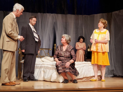 Sarah Sapperstein and Caleb Gibson as Maggie and Brick in MadKap Production's "Cat on a Hot Tin Roof' at Skokie Theatre