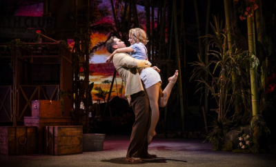 Emile De Becque (Devin Archer, left) sweeps Nellie Forbush (Allsun O'Malley) off her feet in Rodgers and Hammerstein’s South Pacific, the 2025-26 Broadway Series finale at downtown Aurora’s Paramount Theatre. Arguably the most romantic musical of all time, South Pacific is set in a World War II tropical paradise with warm sea breezes, breathless sunsets and B-29 Bombers.